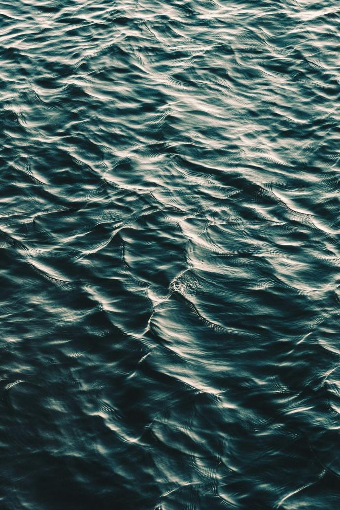 rippling dark teal water surface